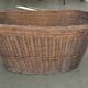 Rustic brown wicker basket from the 1940s — large oval laundry basket