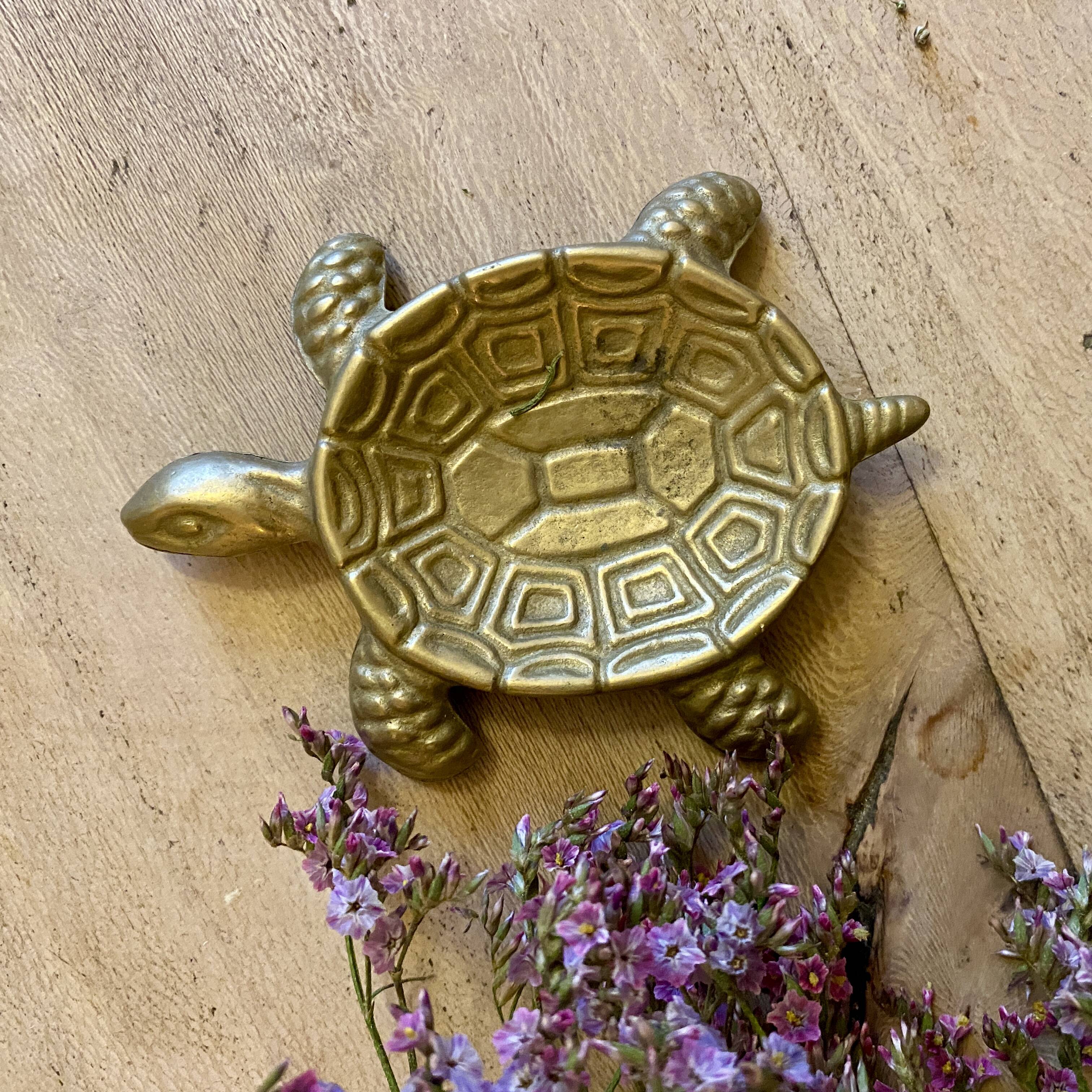 Vintage brass turtle pocket emptier