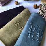 Suite of four tinted antique napkins