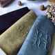 Suite of four tinted antique napkins