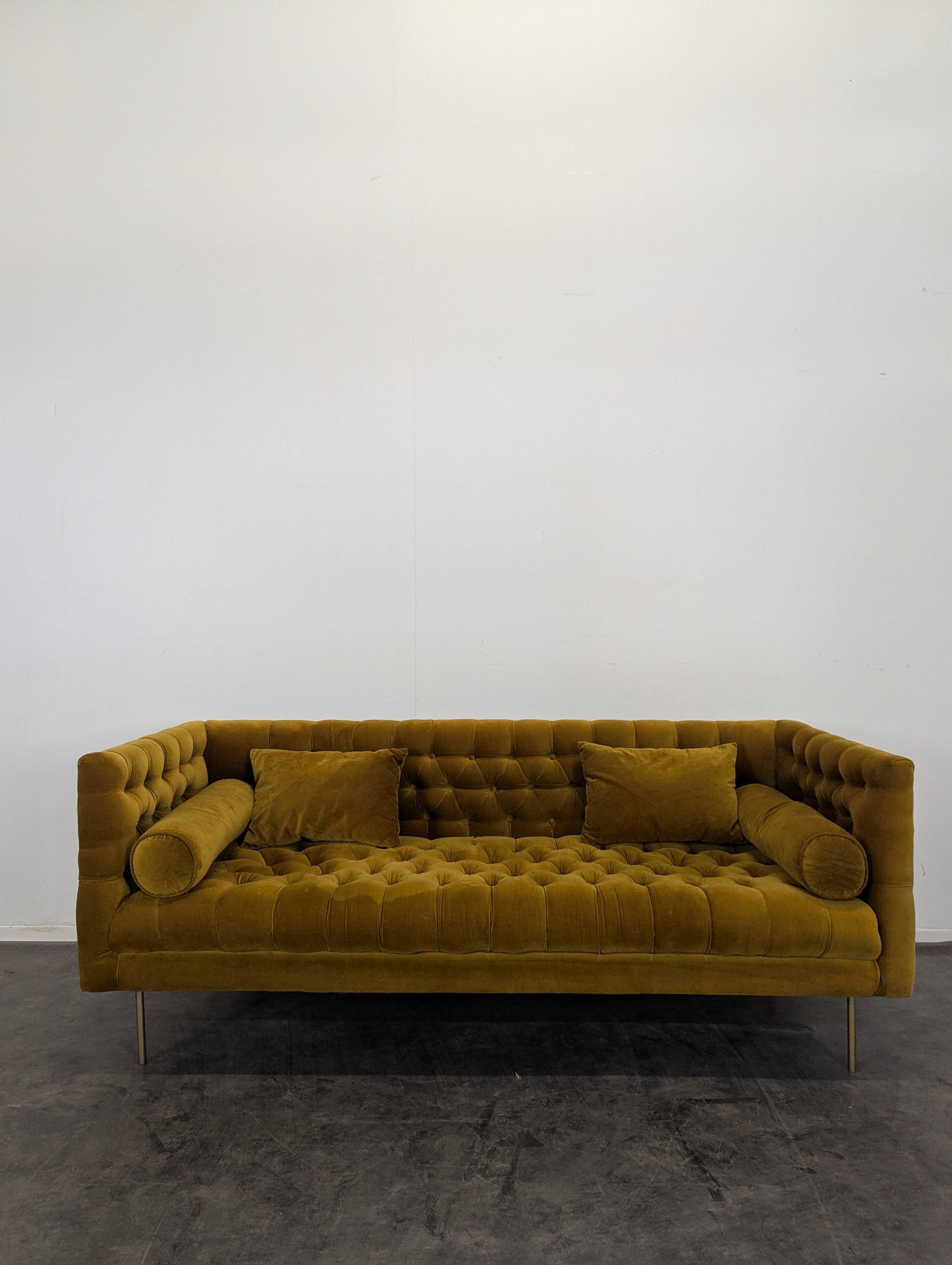 Saffron-colored velvet sofa