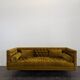 Saffron-colored velvet sofa