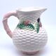 Pale pink slip decanter and colorful fruist