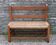 Wooden-backed bench with straw seat, 1970s.