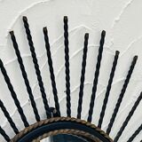 Vintage black and gold metal sun mirror from the 1960s.