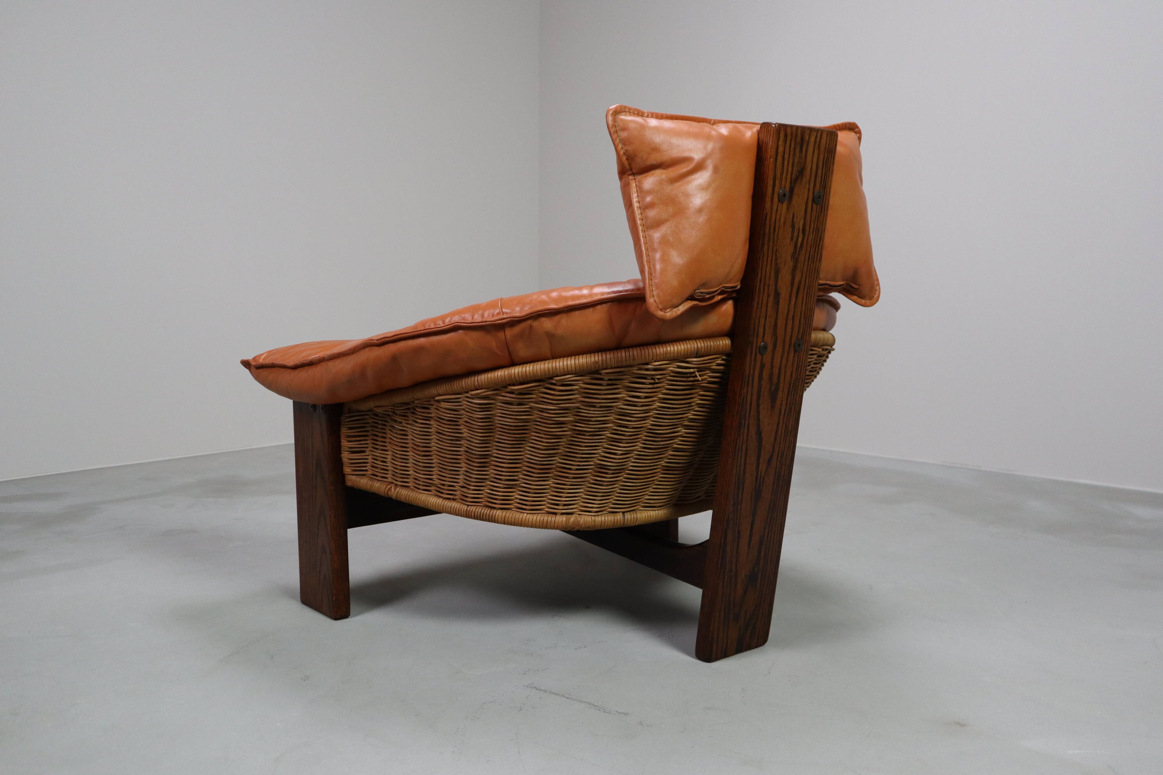 Vintage tripod lounge chair in leather, rattan and oak, Netherlands