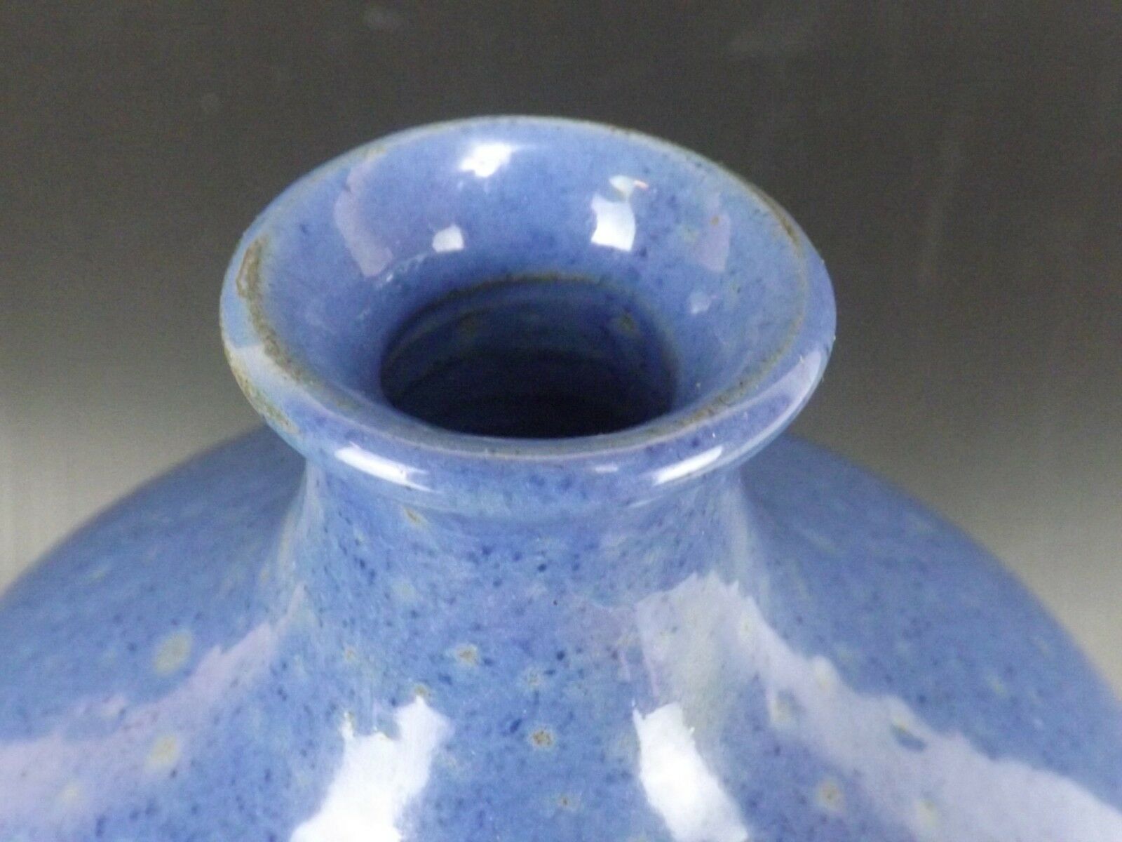 Signed enamelled terracotta bottle vase