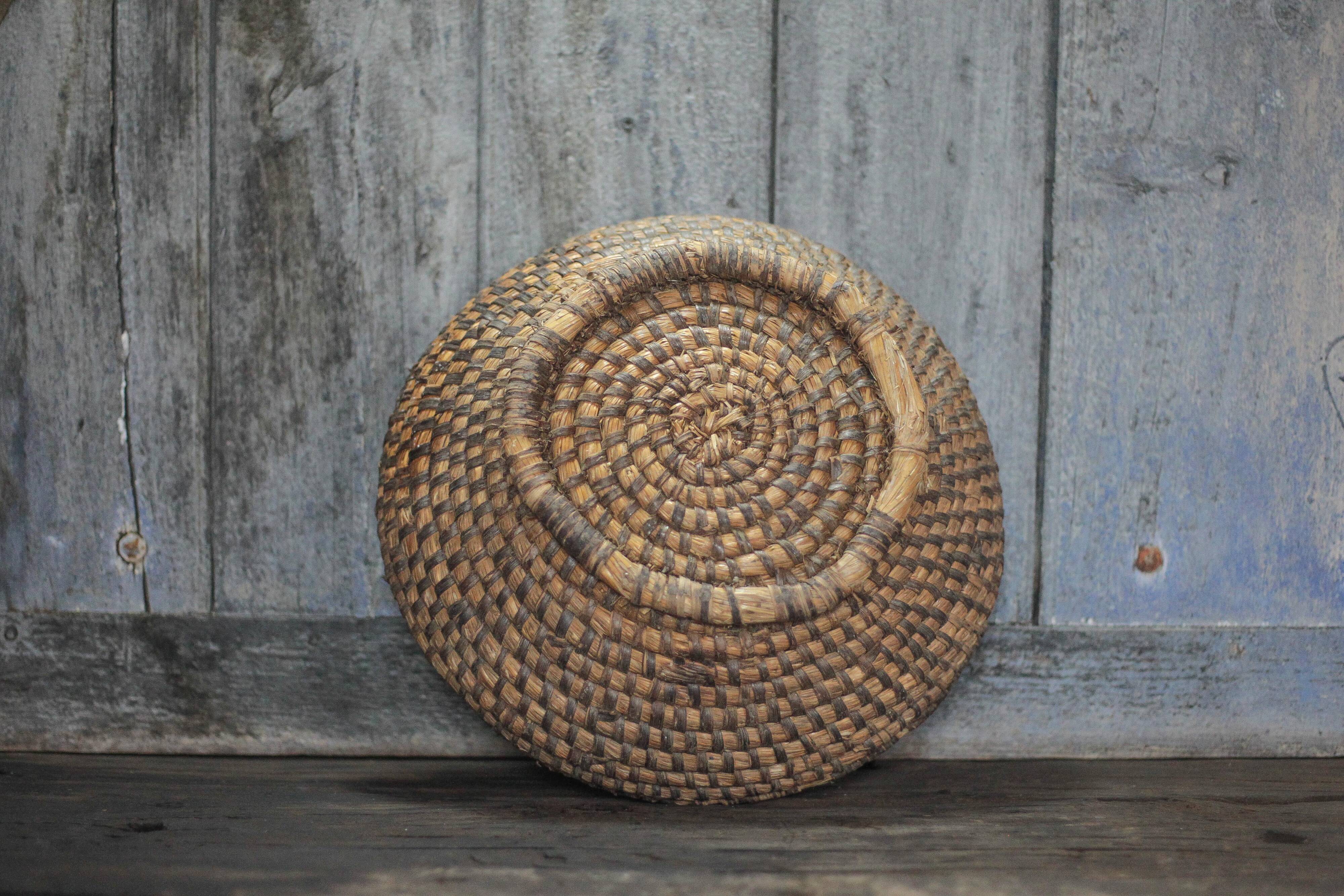 Old wicker basket, straw and bramble, woven basket, countryside.