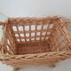 Vintage wicker basket on wheels - children's toy trolley