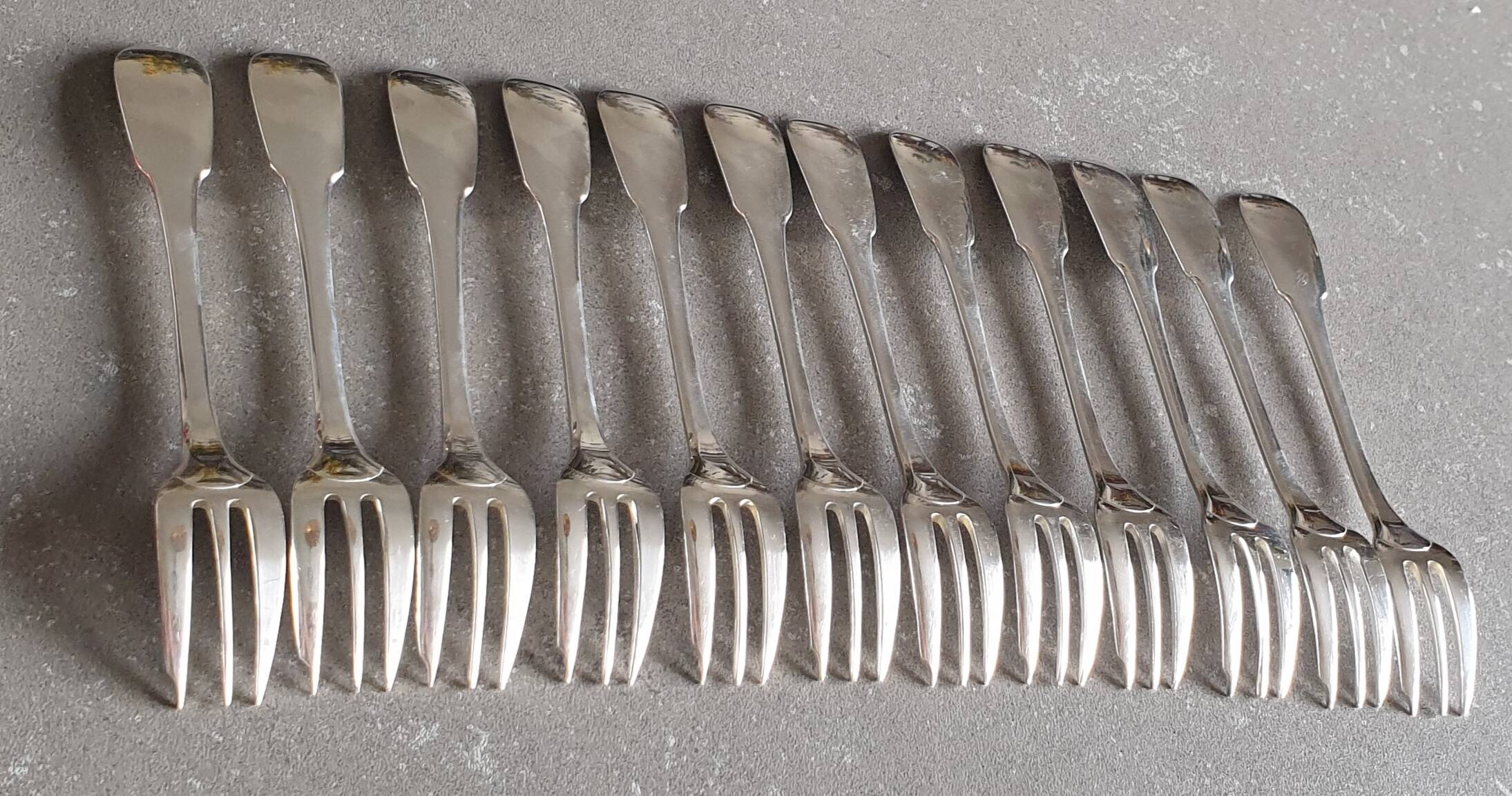Set of 12 dessert forks and a cake server.