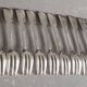 Set of 12 dessert forks and a cake server.