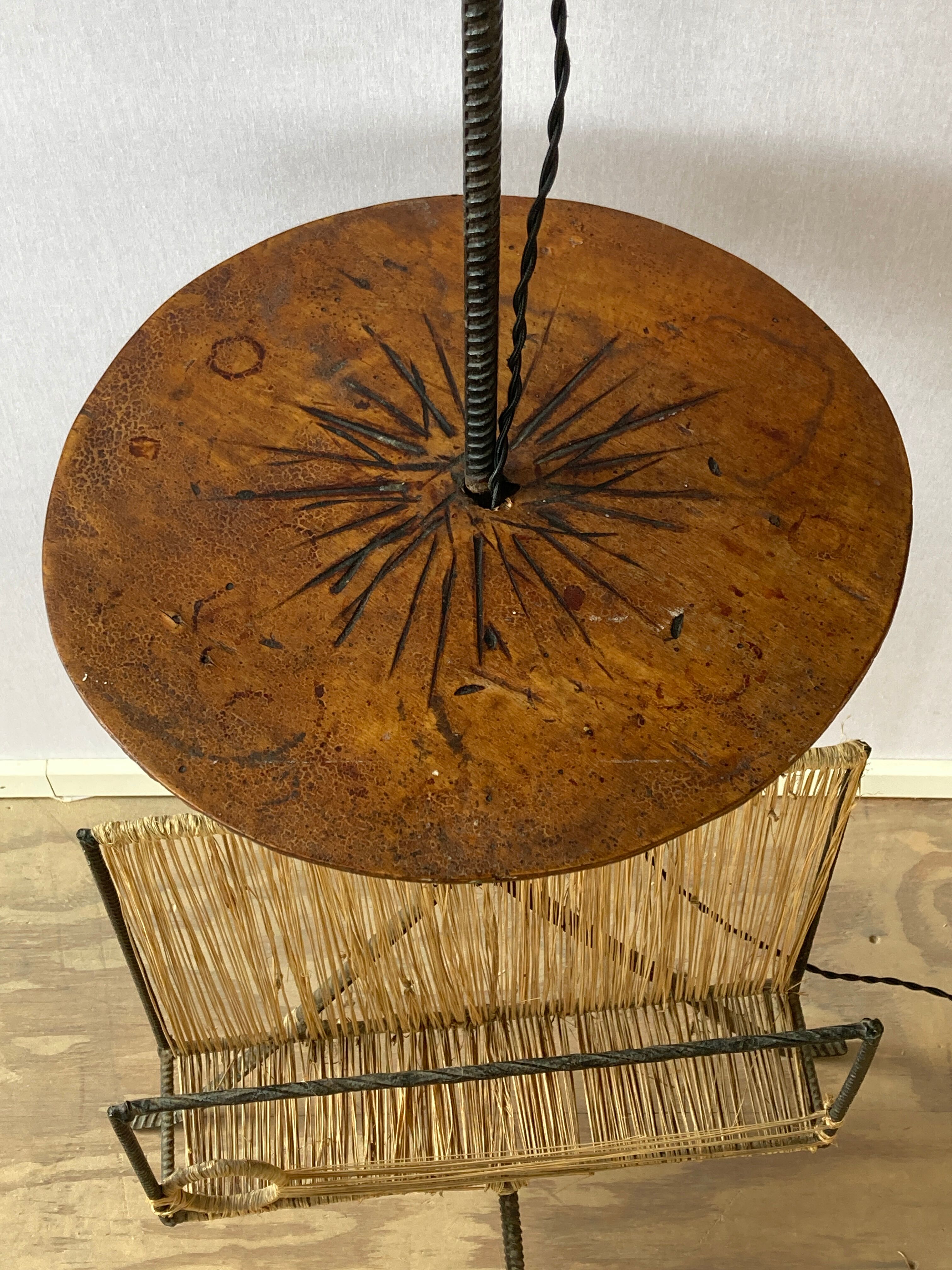 Wrought iron floor lamp with magazine holder and sisal shade, 1950s