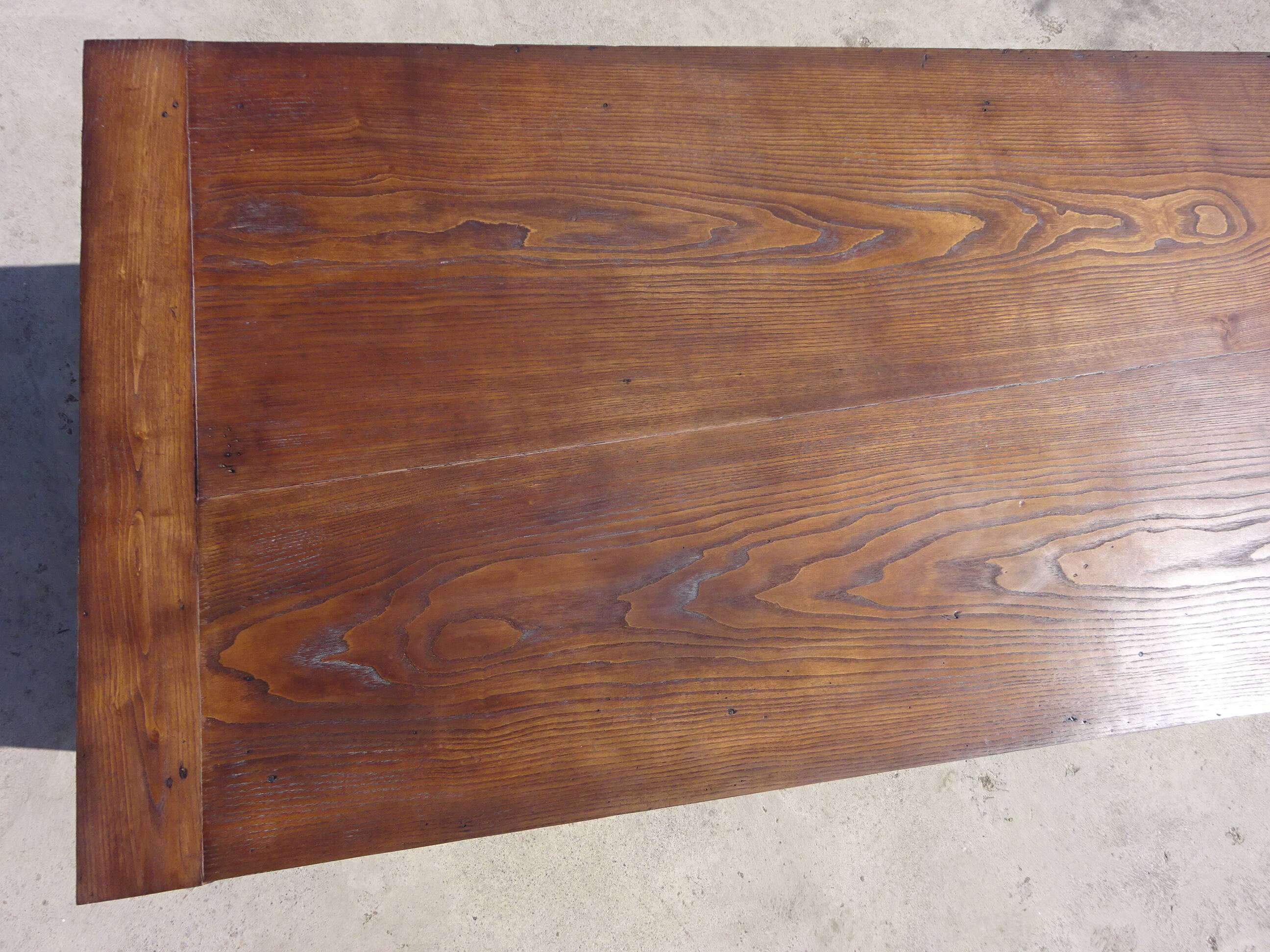 Old farmhouse table made entirely of restored solid oak.