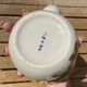 Vintage ceramic tea set for 6 bowls and a teapot.