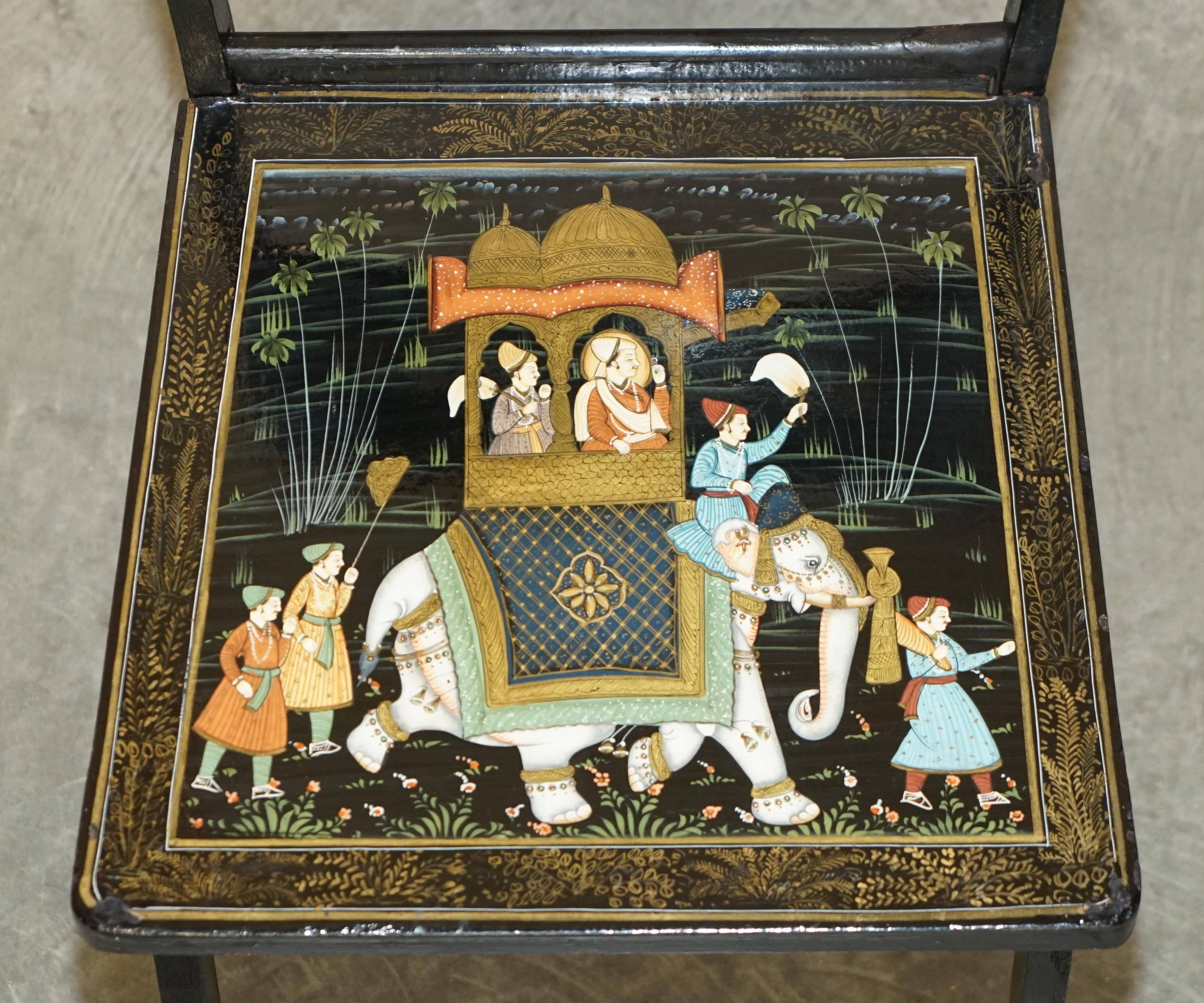 Pair of military folding chairs with Indian decoration.