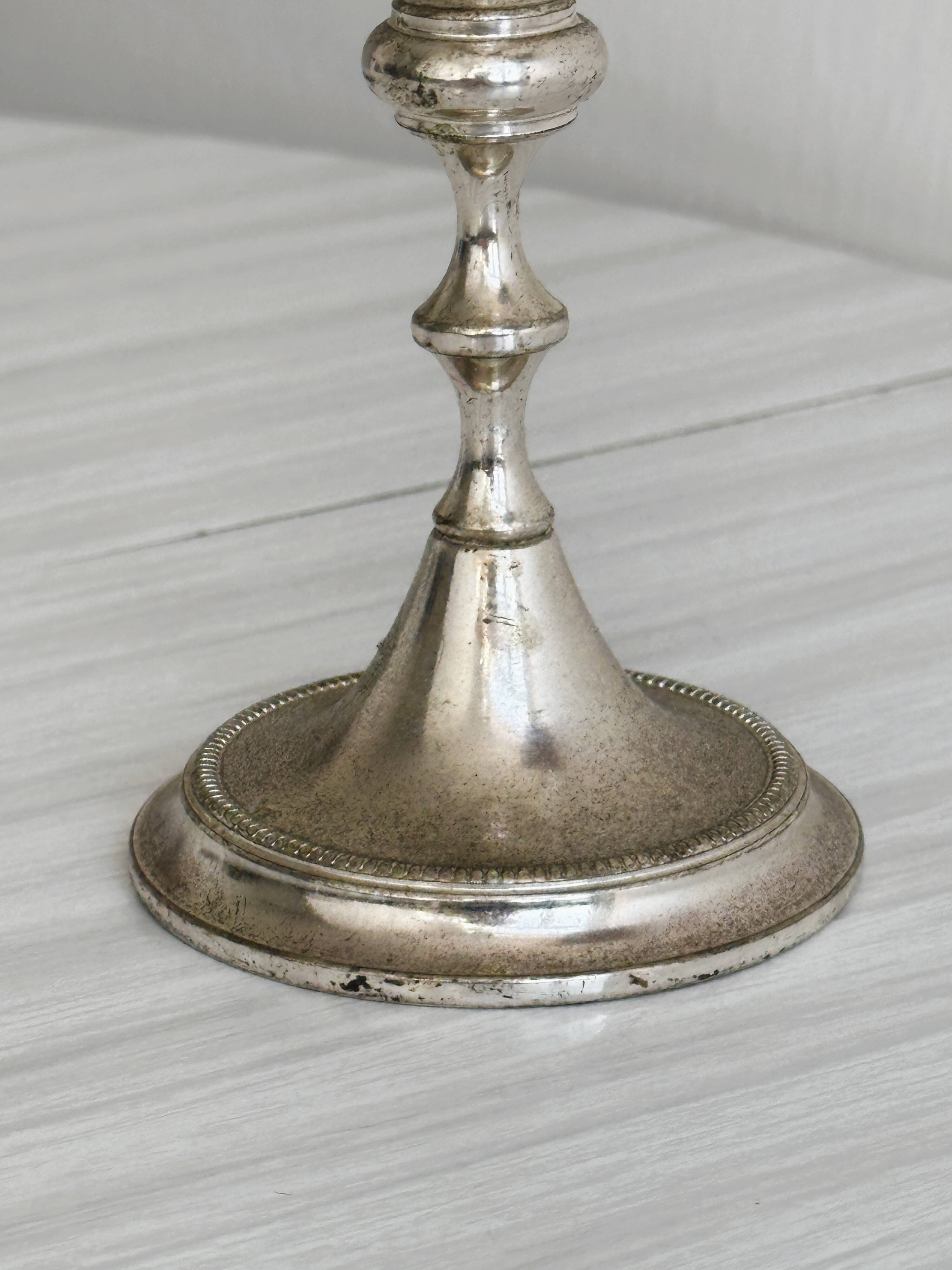 Small patinated candle holder.