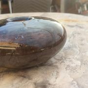Flattened spherical vase made of glass paste
