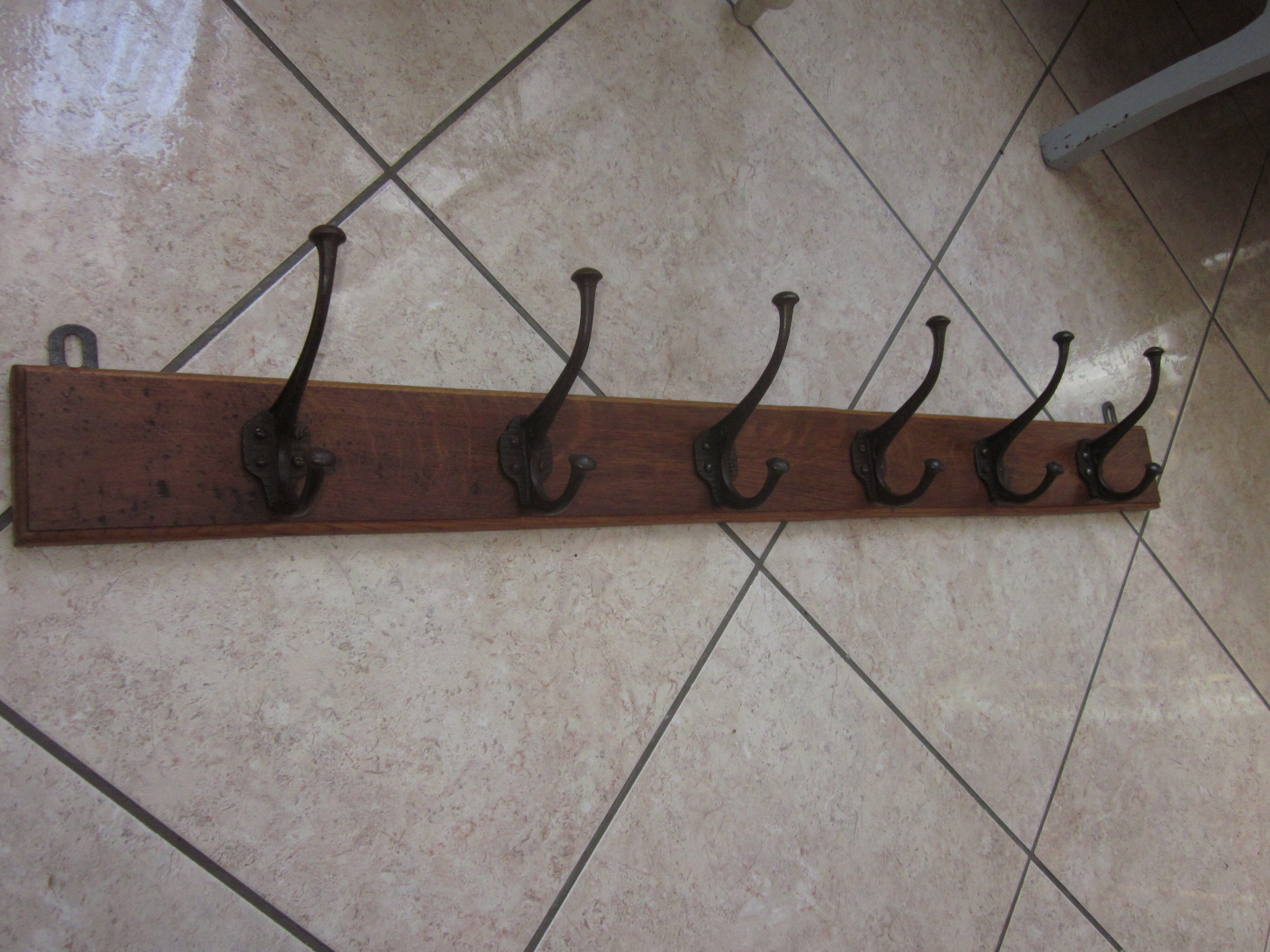 Bistro coat rack has 6 cast iron pads