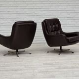 1970s, set of two swivel lounge chairs with footstool, leather.
