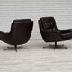 1970s, set of two swivel lounge chairs with footstool, leather.
