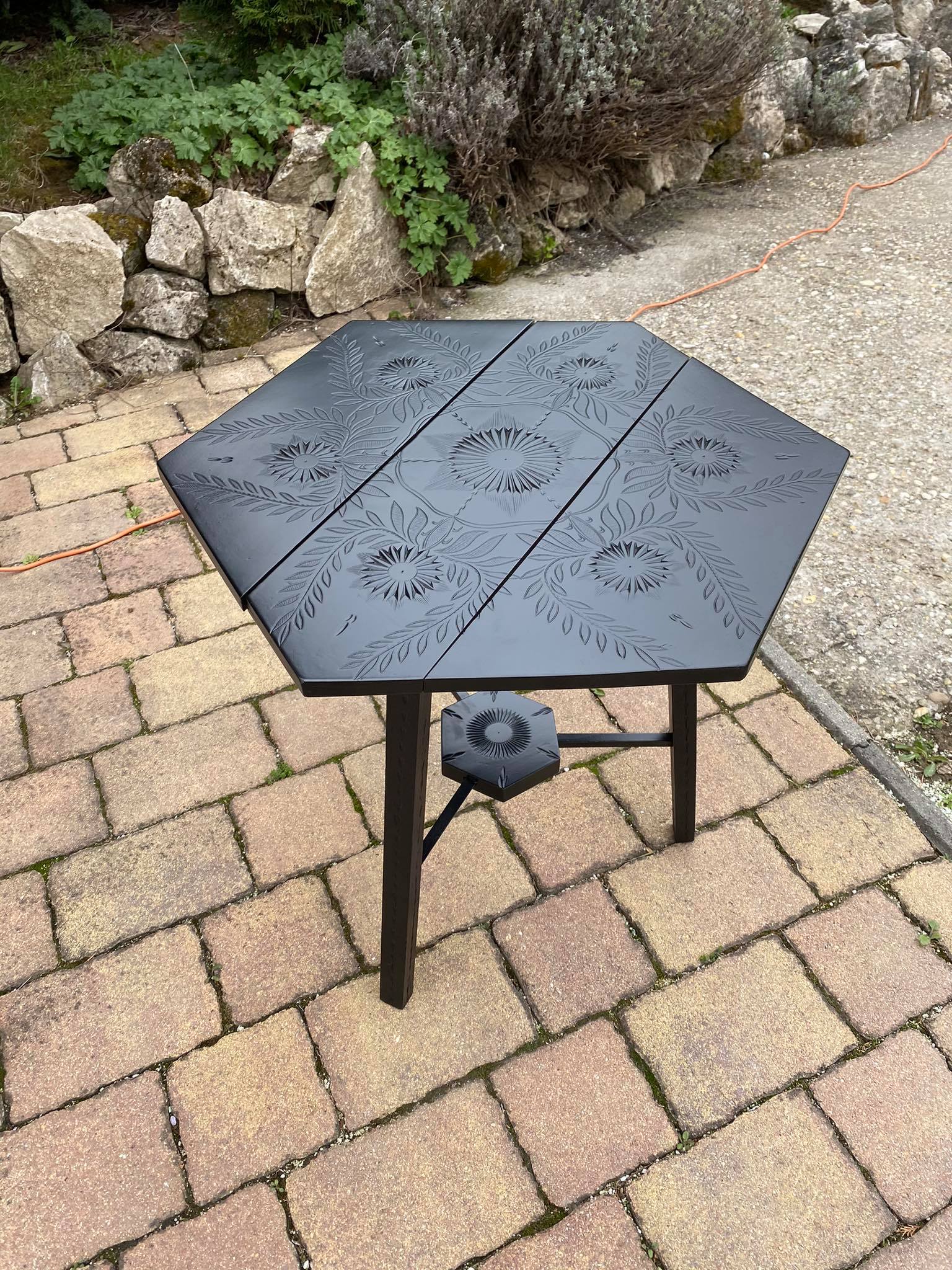 Hand painted black hexagon shaped occasional table.