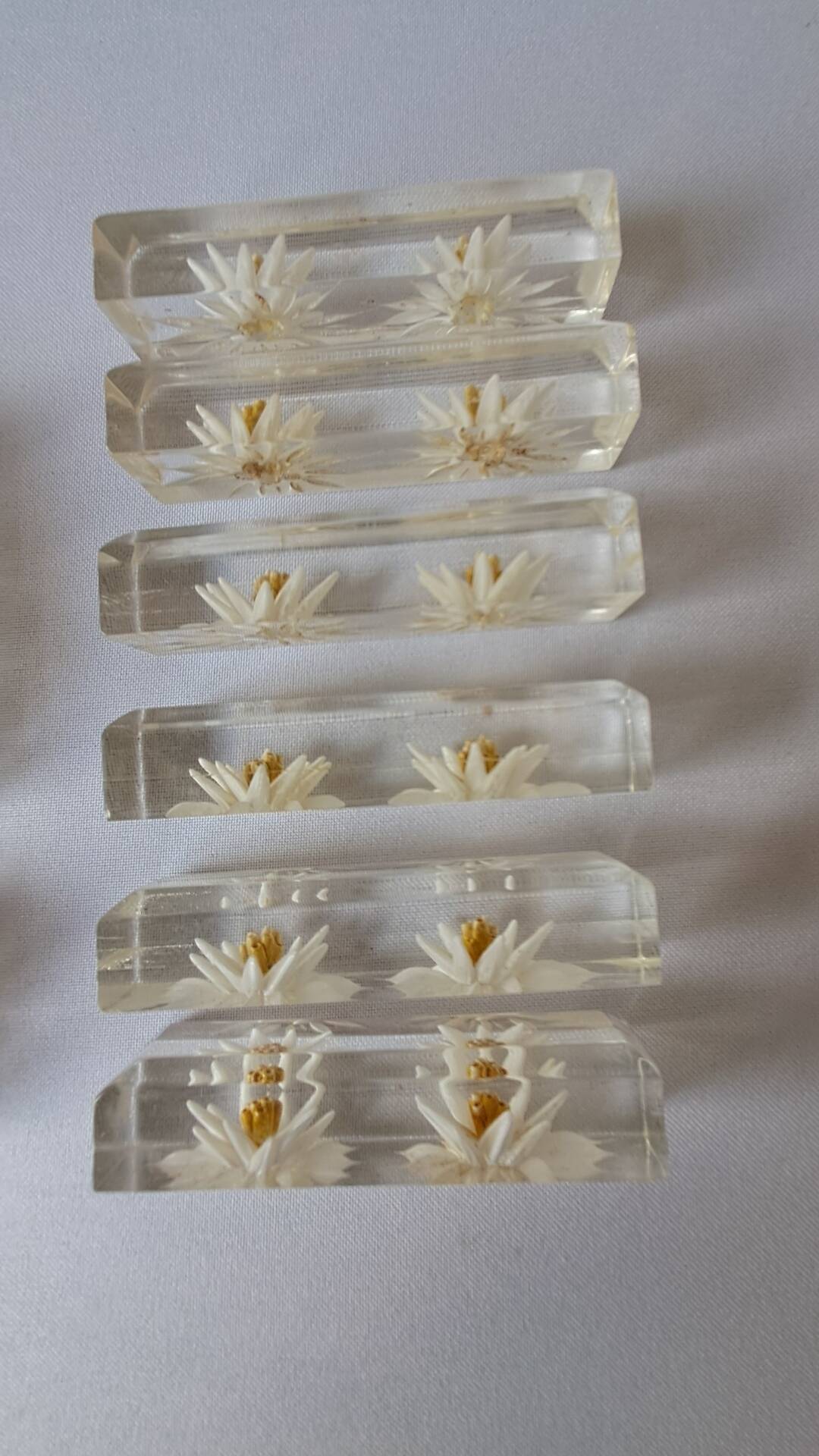 12 knife rests with resin inclusion. 1970s.