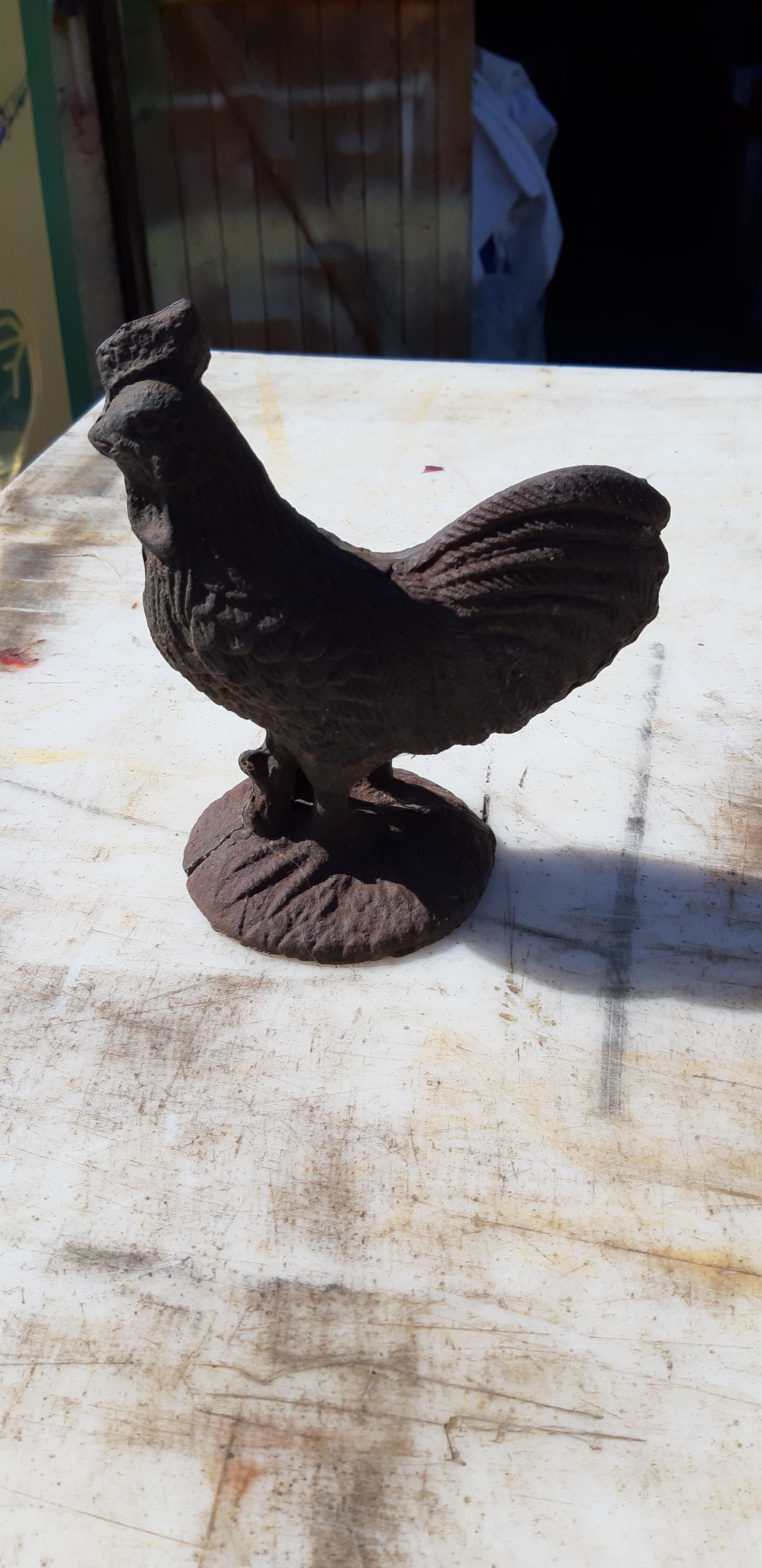 2 roosters and 2 cast iron birds