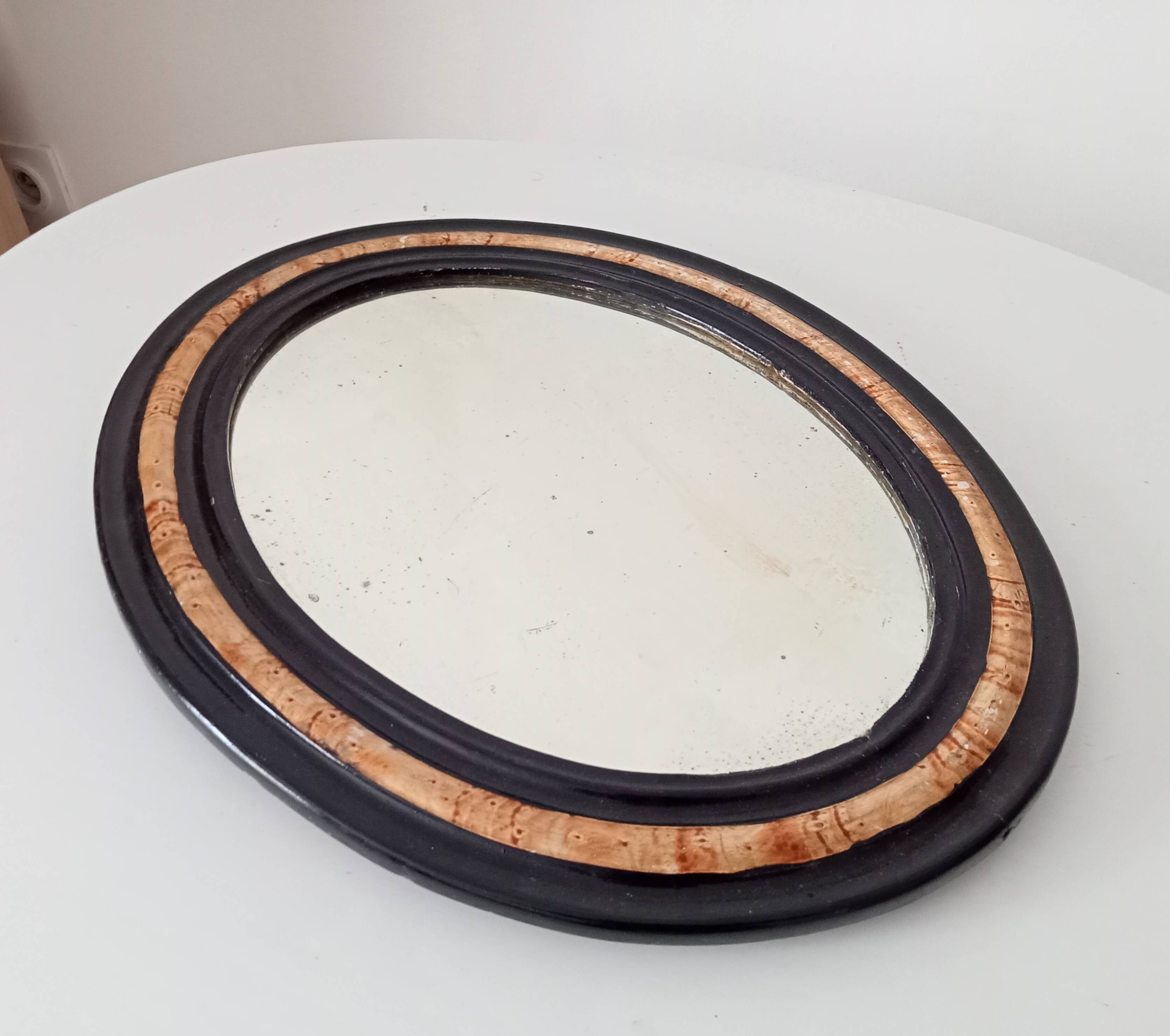 19th-century antique mirror in wood and stucco.