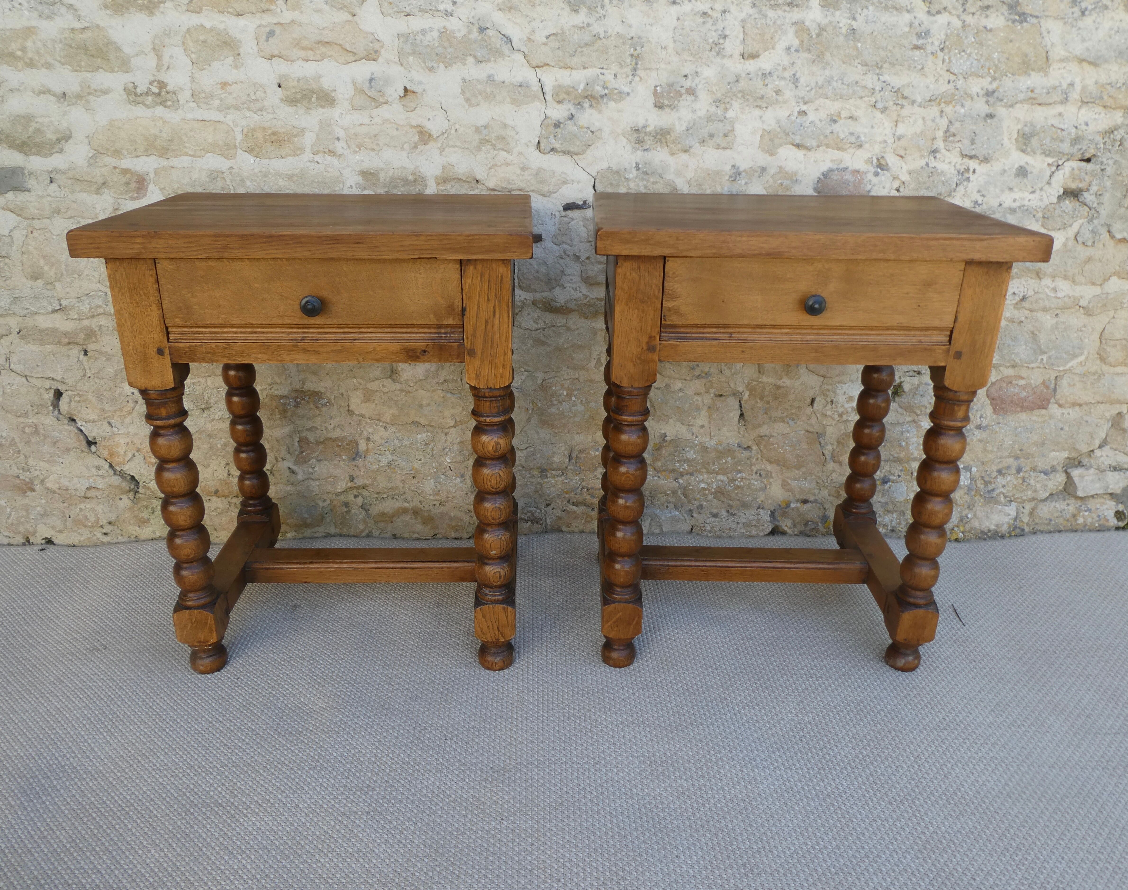 Pair of solid oak bedside tables with carved legs