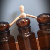 Trio round brown apothecary bottles