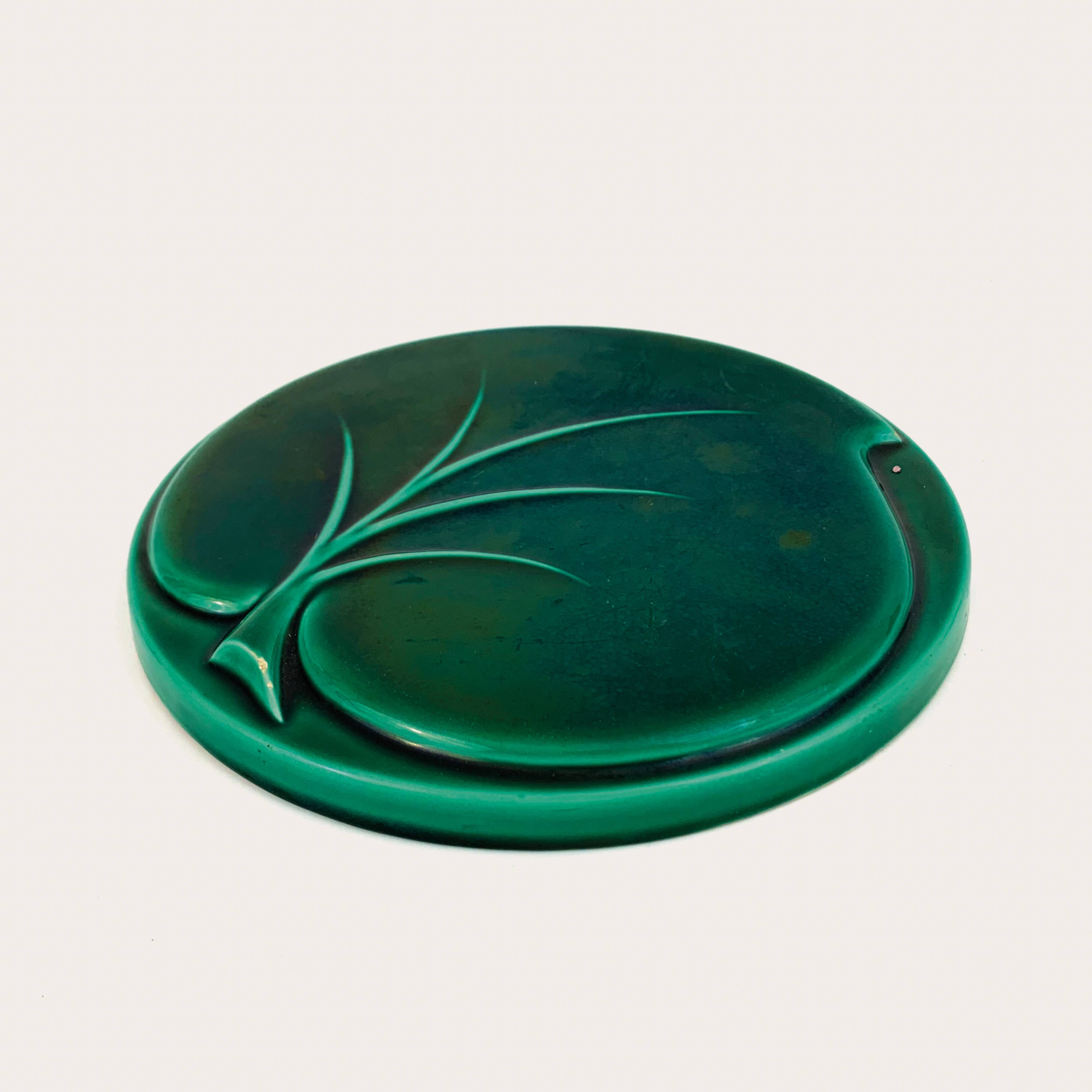 Leaf relief trivet or wall decoration in green varnished ceramic