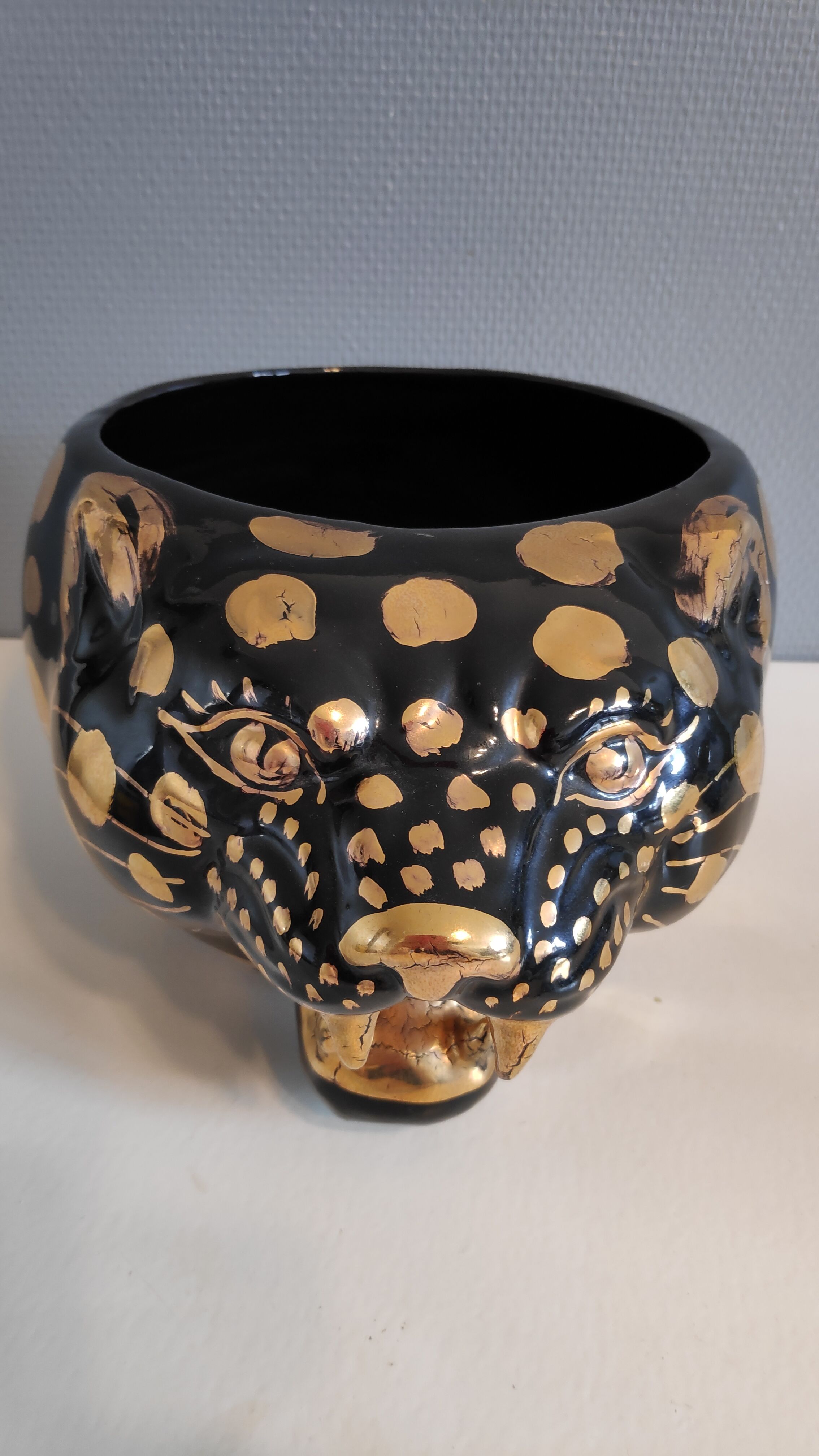 black and gold ceramic panther pot cache