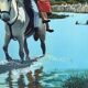 River crossing on horseback, on a sign by Campana.