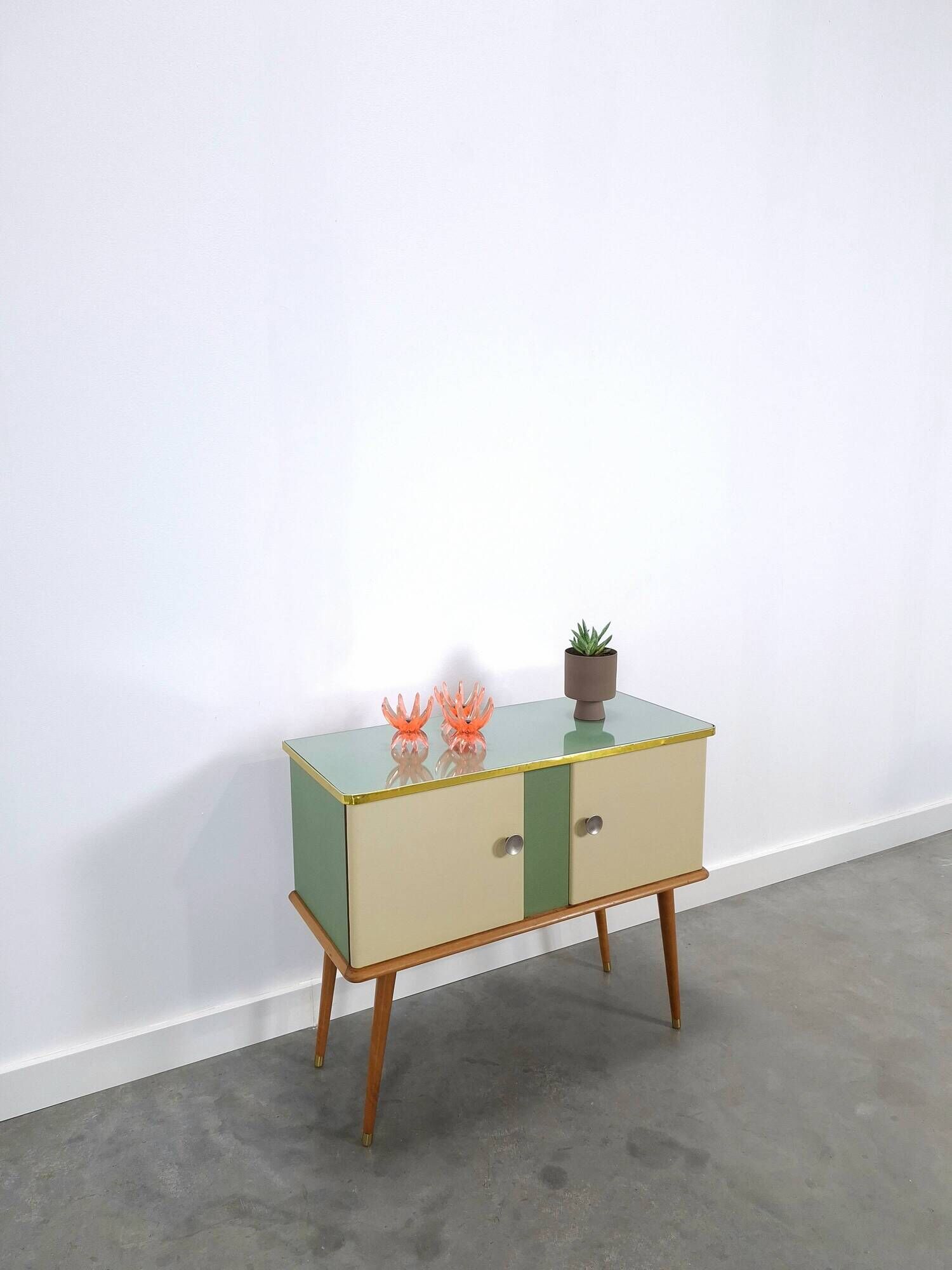 Vintage green DDR cabinet, model Libelle with glass top, slanted legs.