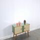 Vintage green DDR cabinet, model Libelle with glass top, slanted legs.