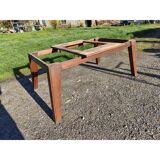 1960s oak dining table with integrated extensions.