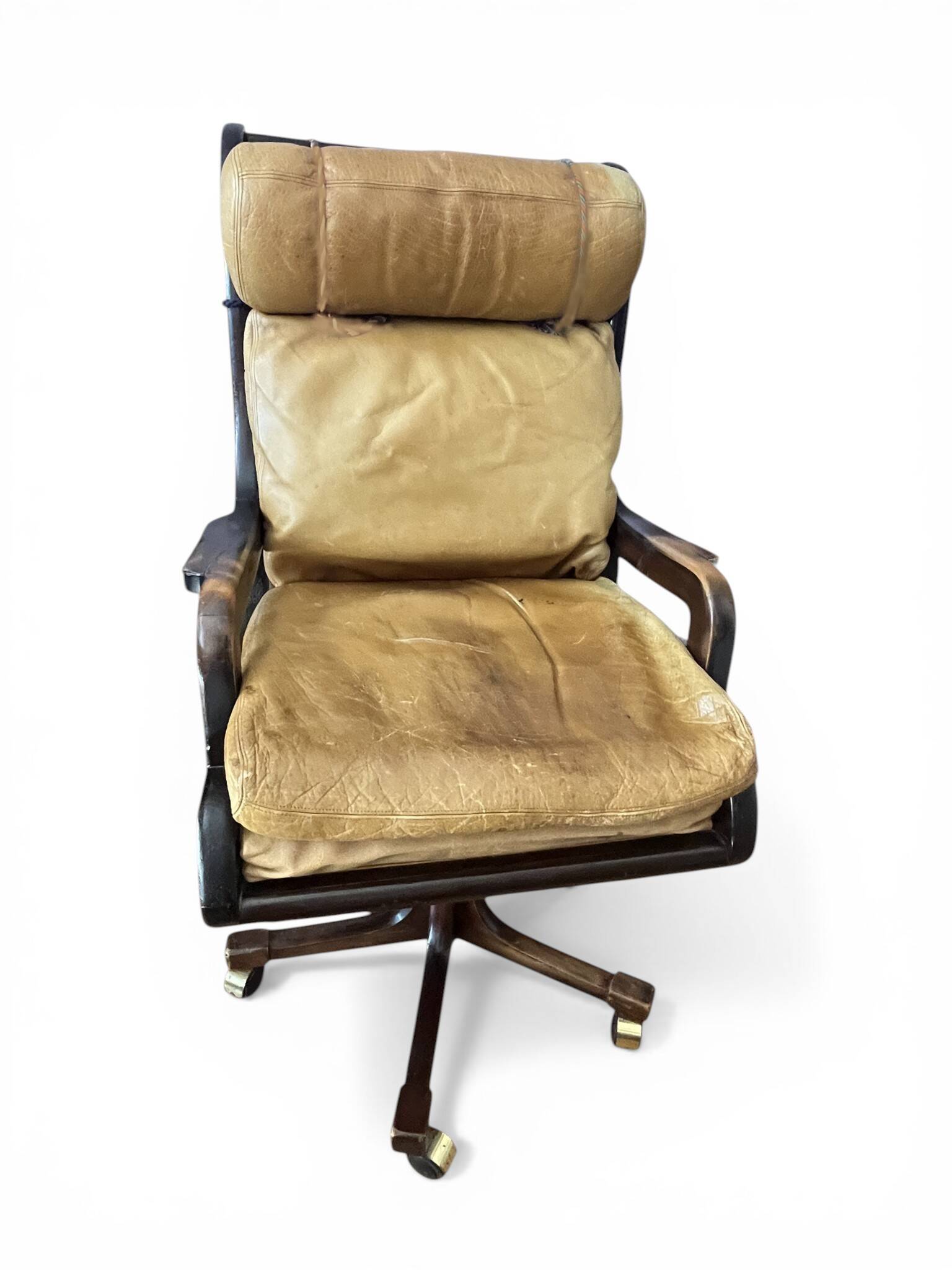 Vintage mahogany and havana leather office chair with wheels from around 1970.