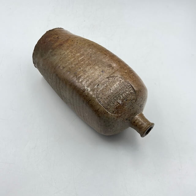 Engraved and square stoneware bottle