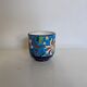 Cache-pot Longwy Art Déco en faïence émaillée décor floral polychrome