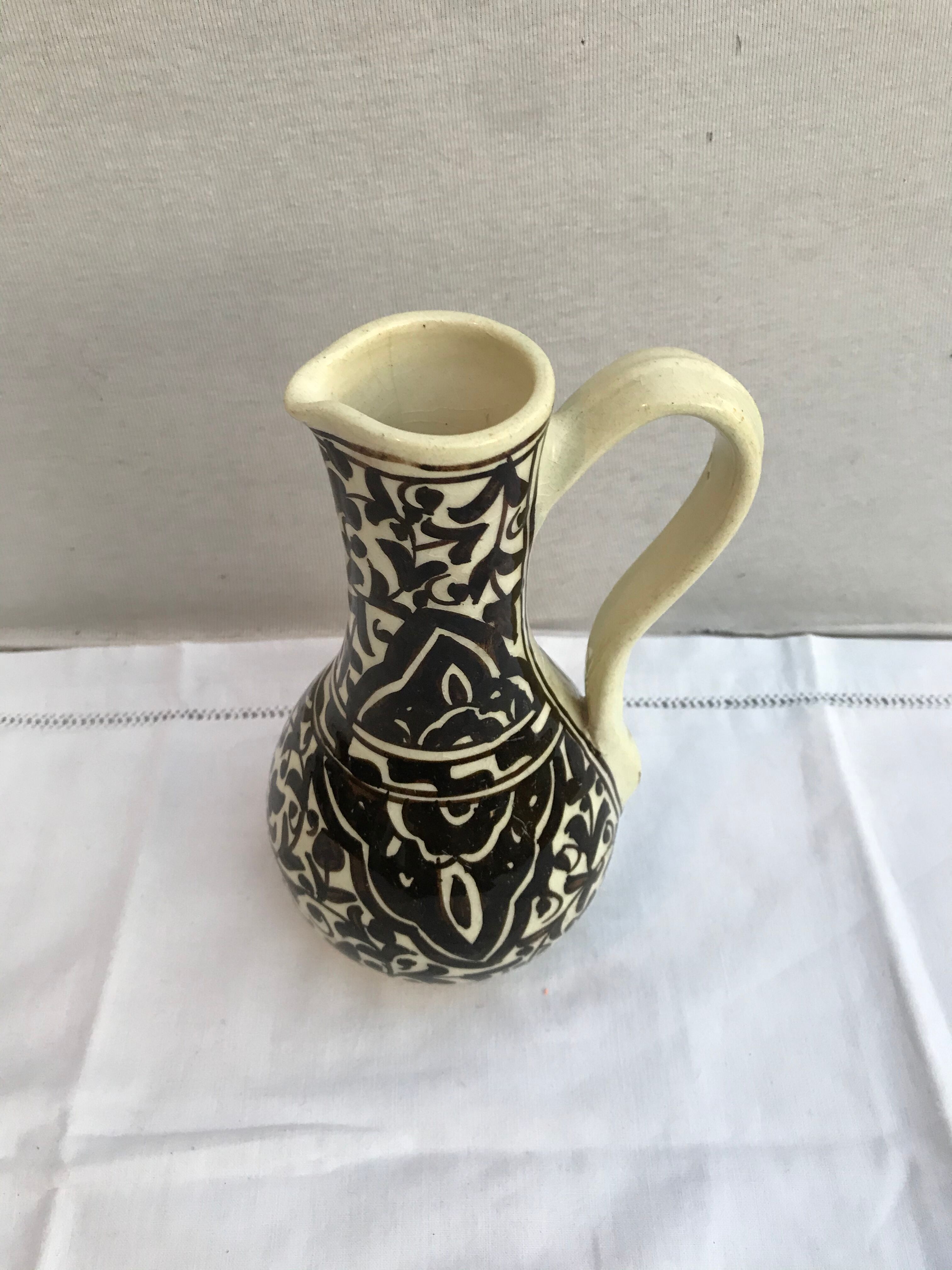 Former beige cracked ceramic pitcher