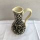 Former beige cracked ceramic pitcher