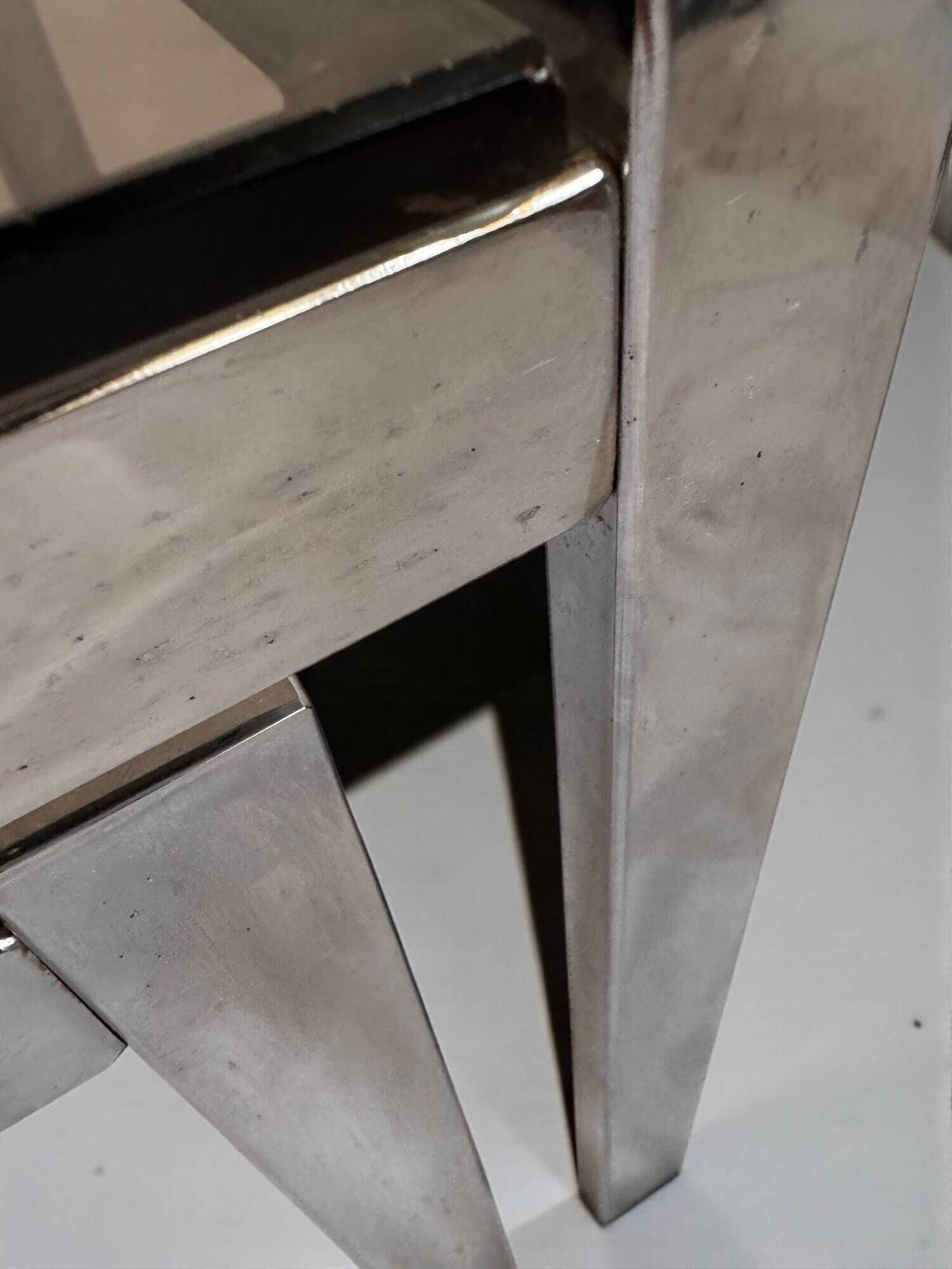 Vintage 1970s nesting tables in chrome and smoked glass, mid-century modernist style