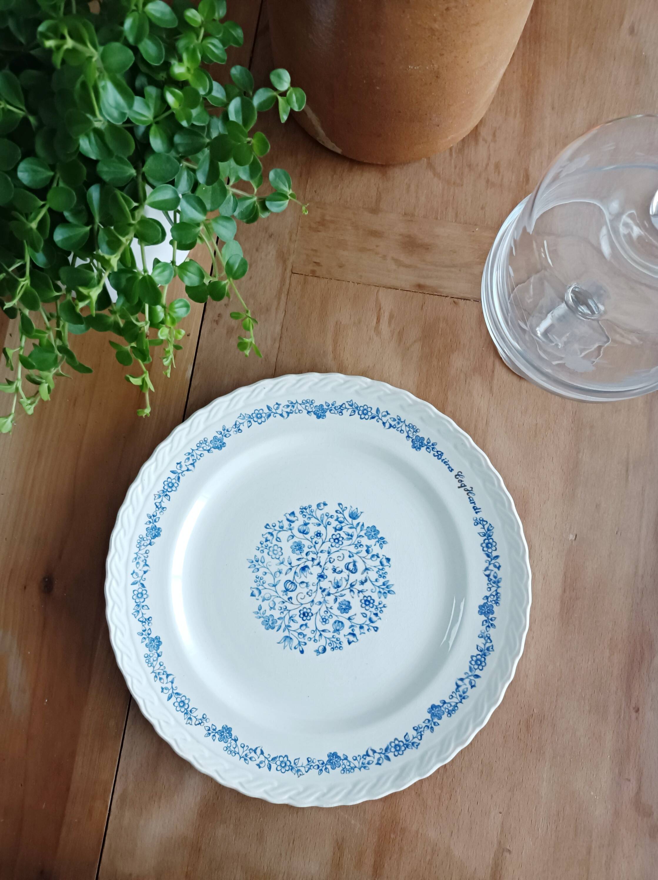 Round antique earthenware dish with floral decoration