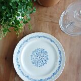 Round antique earthenware dish with floral decoration