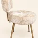 Vintage 1960s dressing table chair with faux fur and golden legs.