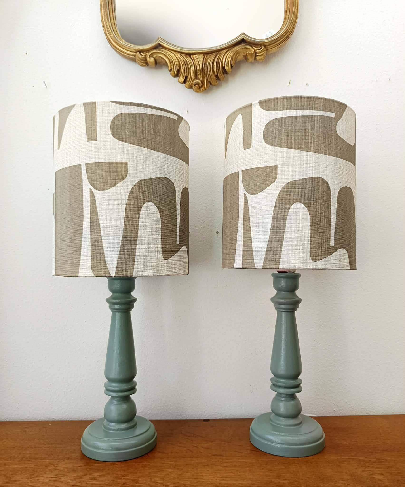 Pair of wooden lamps with custom modernist lampshades.