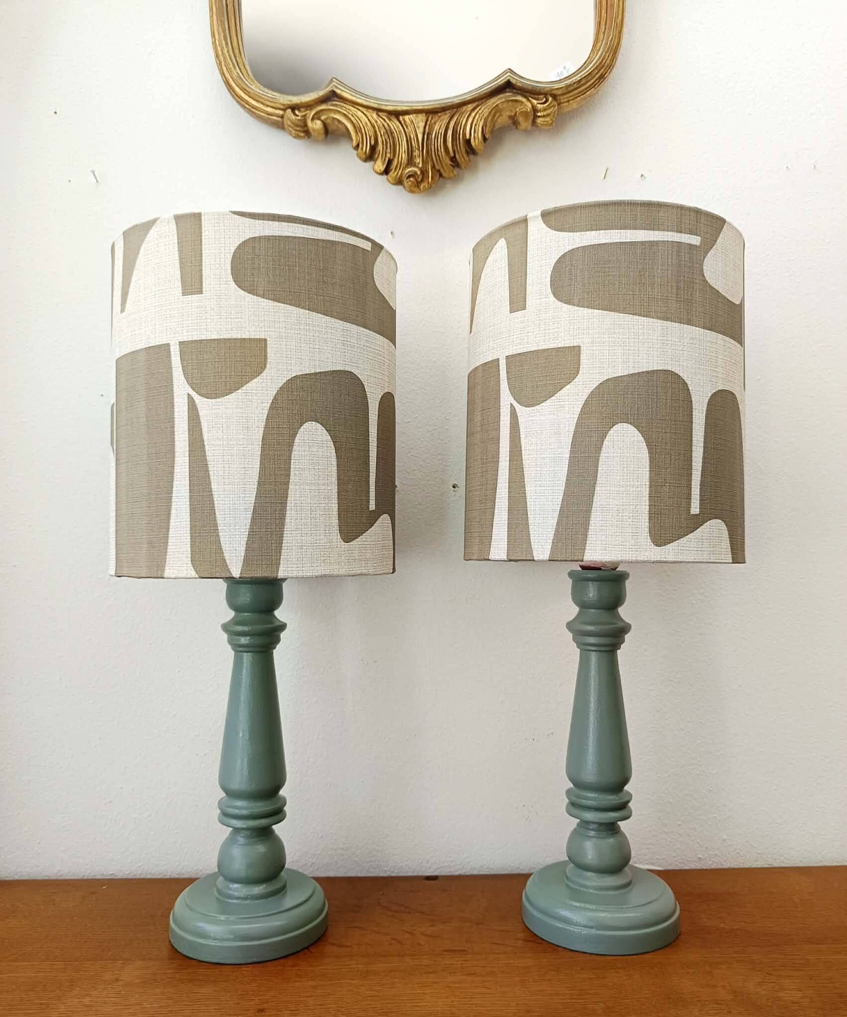 Pair of wooden lamps with custom modernist lampshades.