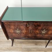 Mid-century mahogany buffet with teal glass and compartments with a drawer.