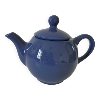 Vintage deep blue teapot, minimalist round shape.