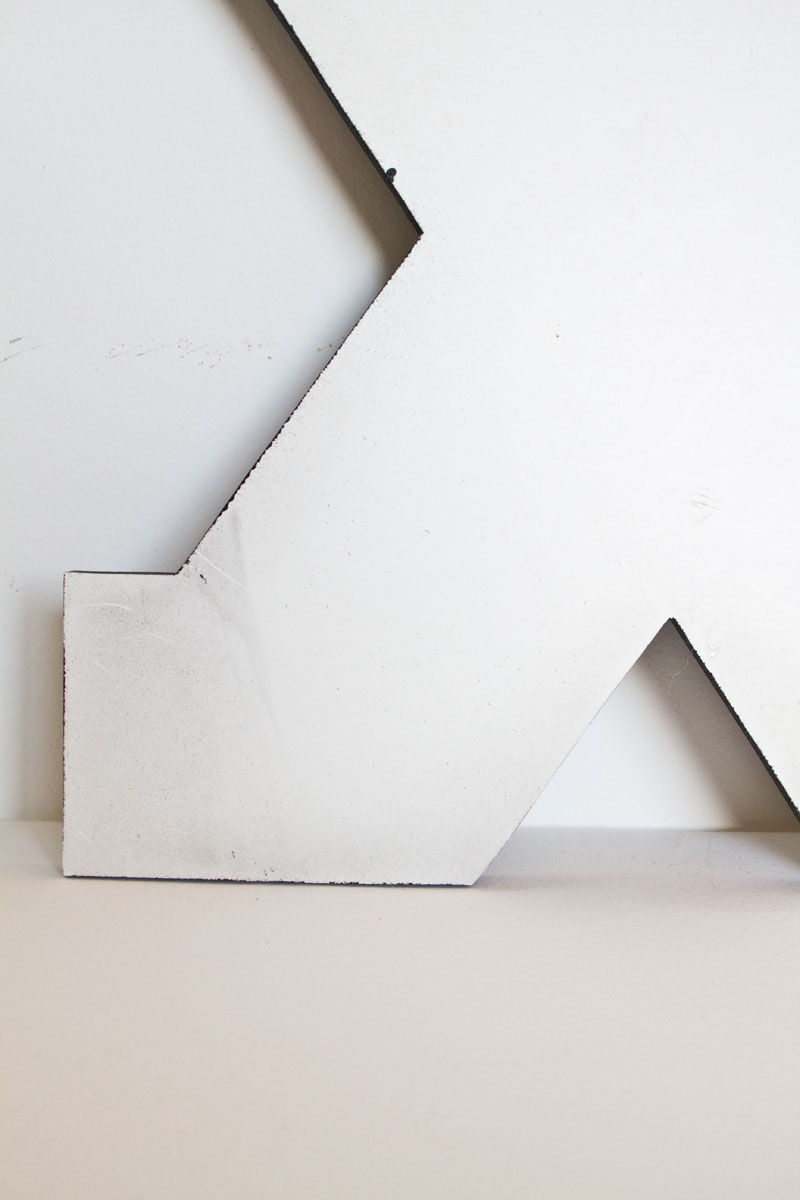 Enamelled letter X